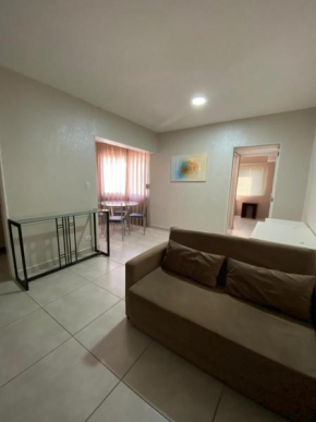 Ap flat central- ar, garagem e ótima localização